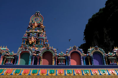 Low angle view of building against blue sky