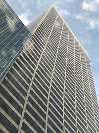 Low angle view of modern building against sky