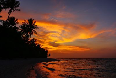 Scenic view of sea against orange sky