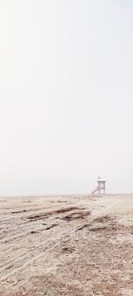 Lifeguard watchtower on a foggy beach