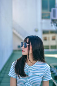 Portrait of woman wearing sunglasses