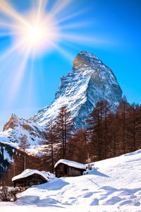 Snow covered mountain against sky