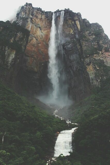 water, rock formation, waterfall, rock - object, scenics, beauty in nature, mountain, motion, flowing water, nature, cliff, long exposure, rocky mountains, tranquil scene, geology, tranquility, flowing, rock, idyllic, non-urban scene