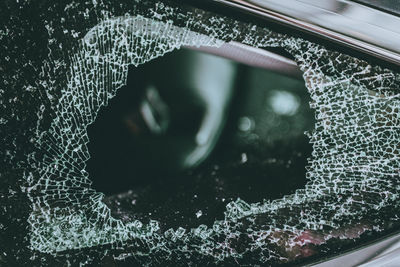 Close-up of broken car window