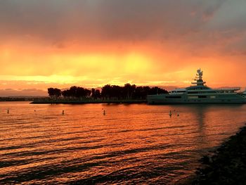 Scenic view of sea against orange sky