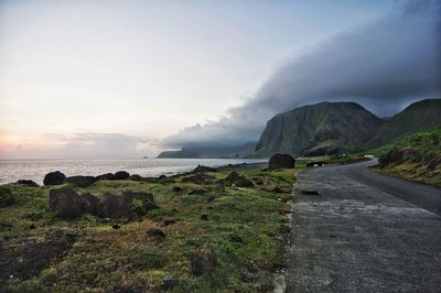 Road by sea against sky