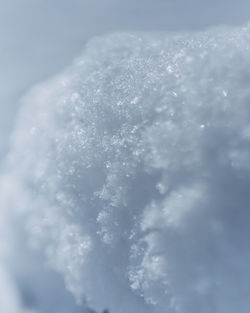 Low angle view of snow against sky