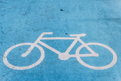 High angle view of bicycle sign on road