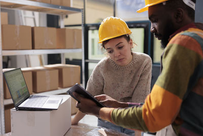 Side view of man working at office