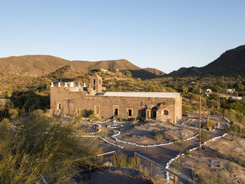 High angle view of mission santa rosalia de mulege by mountains against sky