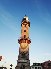 Low angle view of tower against blue sky