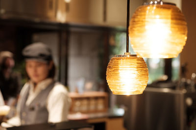 Close-up of tea light candles in restaurant