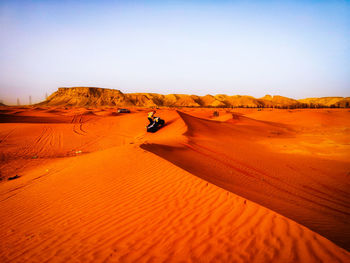 Scenic view of desert against clear sky