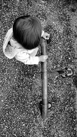 Directly above shot of girl standing by railing