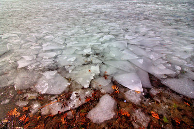 High angle view of ice floating on water