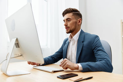 Portrait of businessman working at office