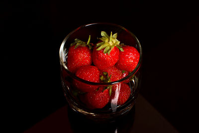 Close-up of strawberries in glass on table