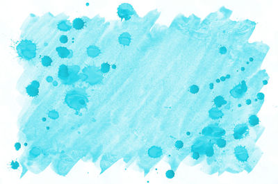Close-up of blue water against white background