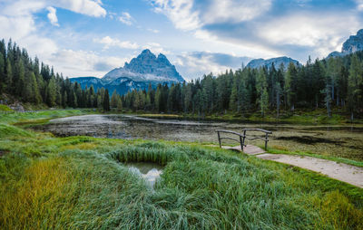 Scenic view of green mountains against sky