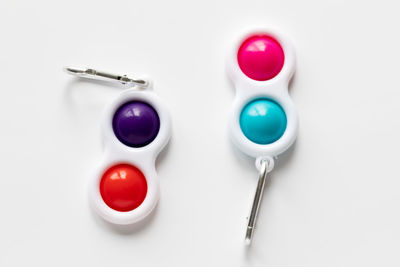 High angle view of candies on table against white background