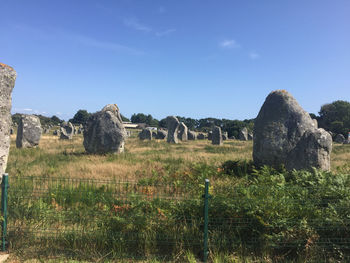 Built structure on field against sky