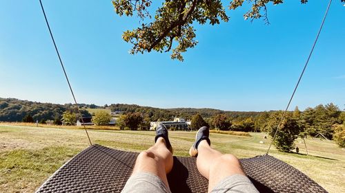 Low section of man relaxing on land