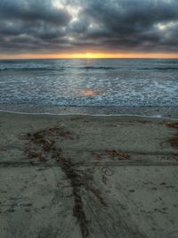 Scenic view of sea against cloudy sky