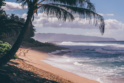 Scenic view of beach against sky