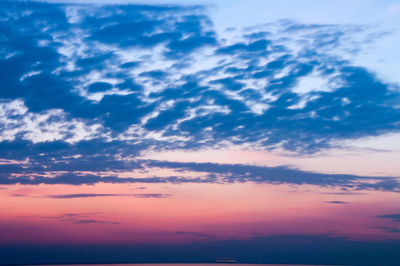 Scenic view of dramatic sky over sea during sunset