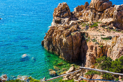 High angle view of rock formations at sea shore