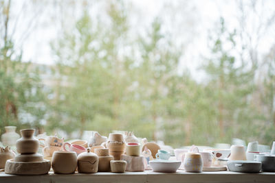 Stack of food on table against trees