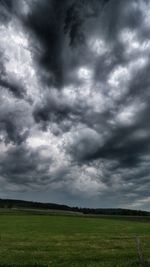 Storm clouds over field