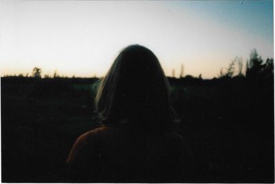 Woman standing on field