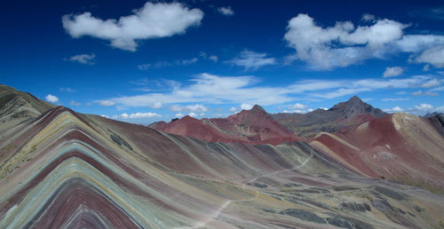 Scenic view of mountains against cloudy sky