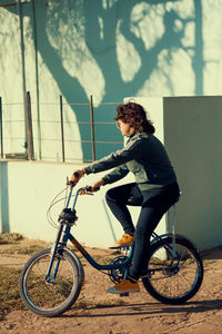 Vintage styled woman cycling