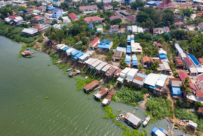 High angle view of river amidst buildings and houses