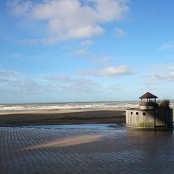 Scenic view of sea against cloudy sky