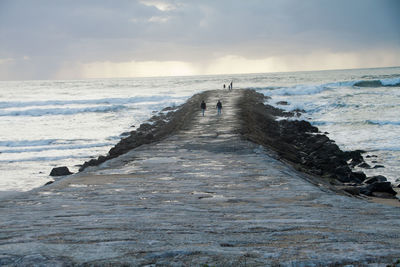 Pier over sea against sky