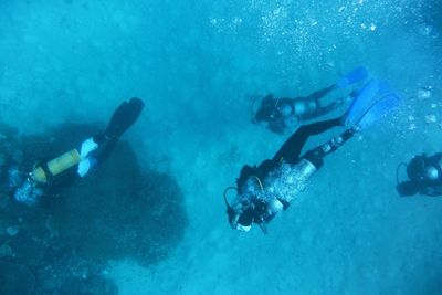 People swimming in sea