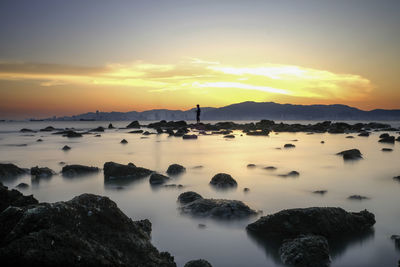 Scenic view of sea against sky during sunset