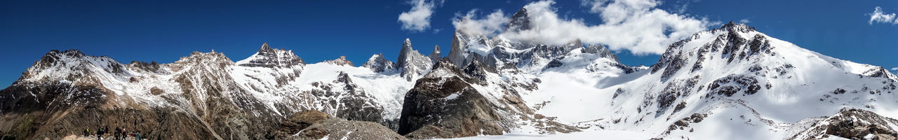 Panoramic view of snowcapped mountains against sky