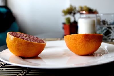 Close-up of grapefruit on table at home