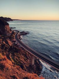 View of calm beach at sunset