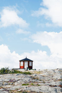 Wooden building against sky