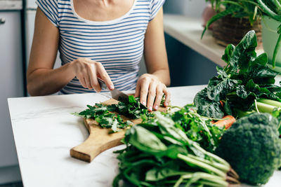 Midsection of woman preparing food