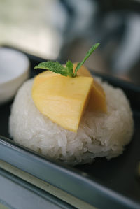 Close-up of lemon slice in plate