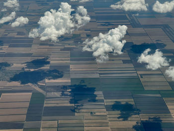 View from the airplane window, clouds and fields