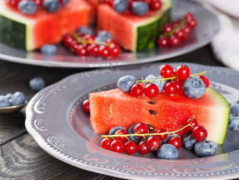 High angle view of strawberries in plate on table