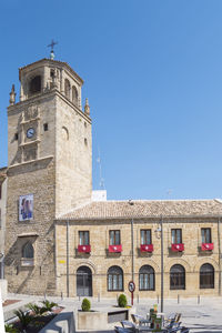 Low angle view of building against clear blue sky