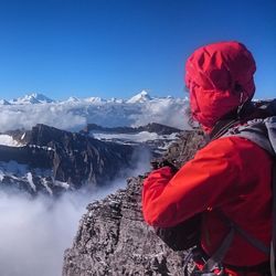 Snow covered mountain against cloudy sky